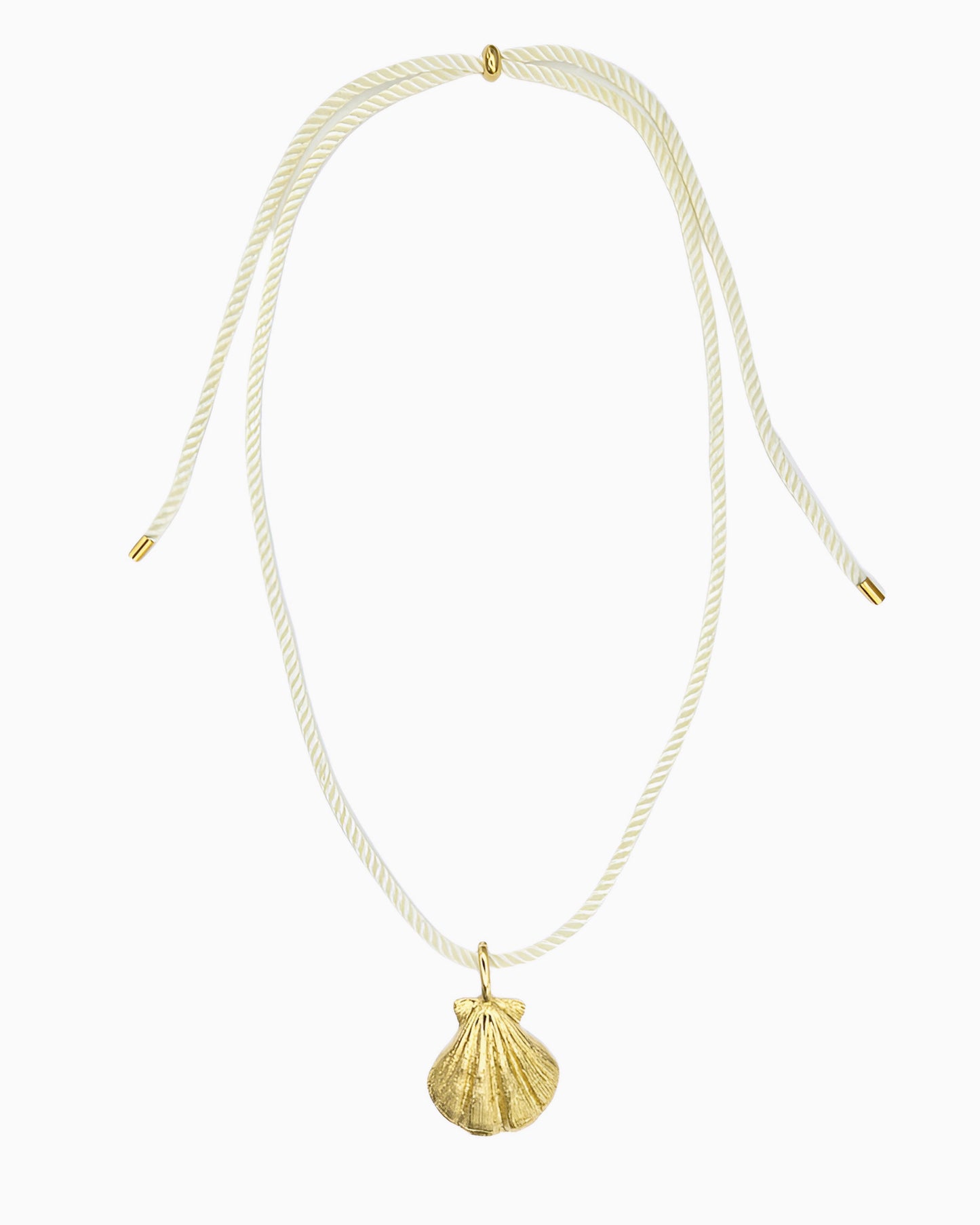 Ivory cord necklace featuring a detailed seashell clip-on charm inspired by a shell found along the shore.