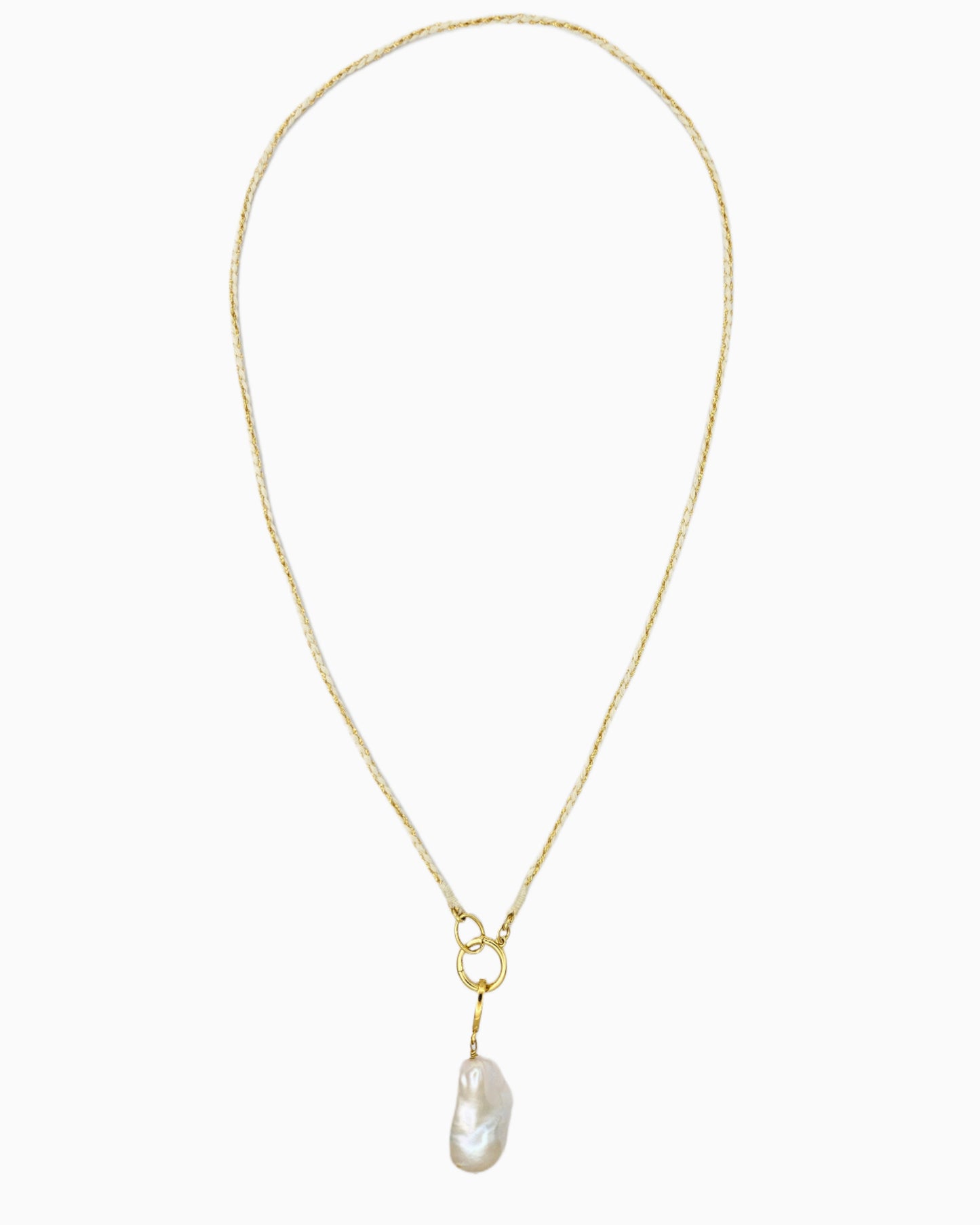 Braided ivory and gold cord necklace with a detachable baroque freshwater pearl pendant and hinged charm holder.