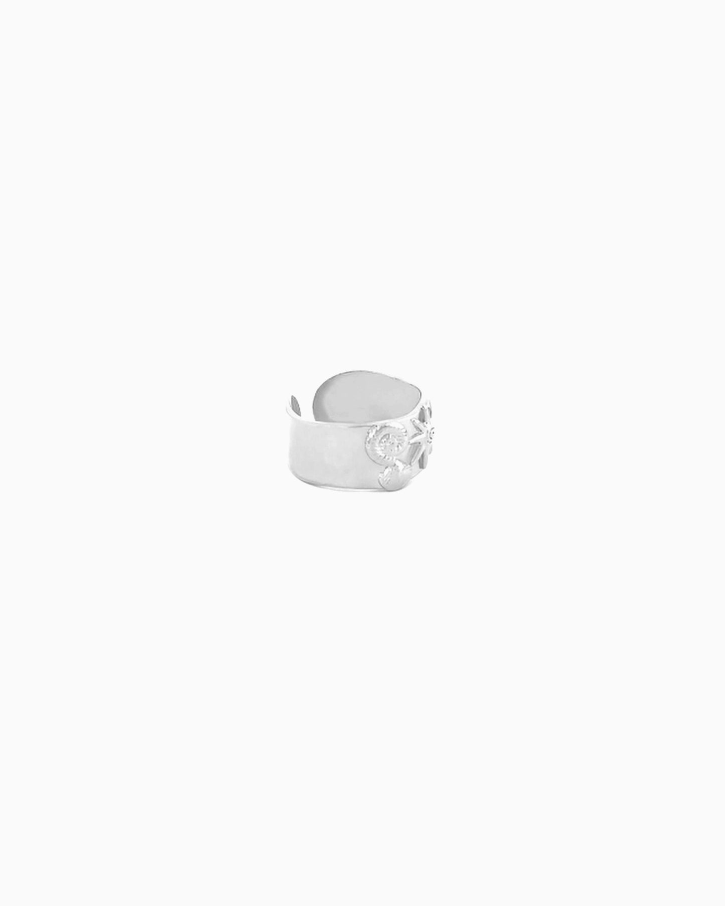 Shoreside Ring featuring sunray, nautilus shell, and seashell motifs on a polished wide-band adjustable ring