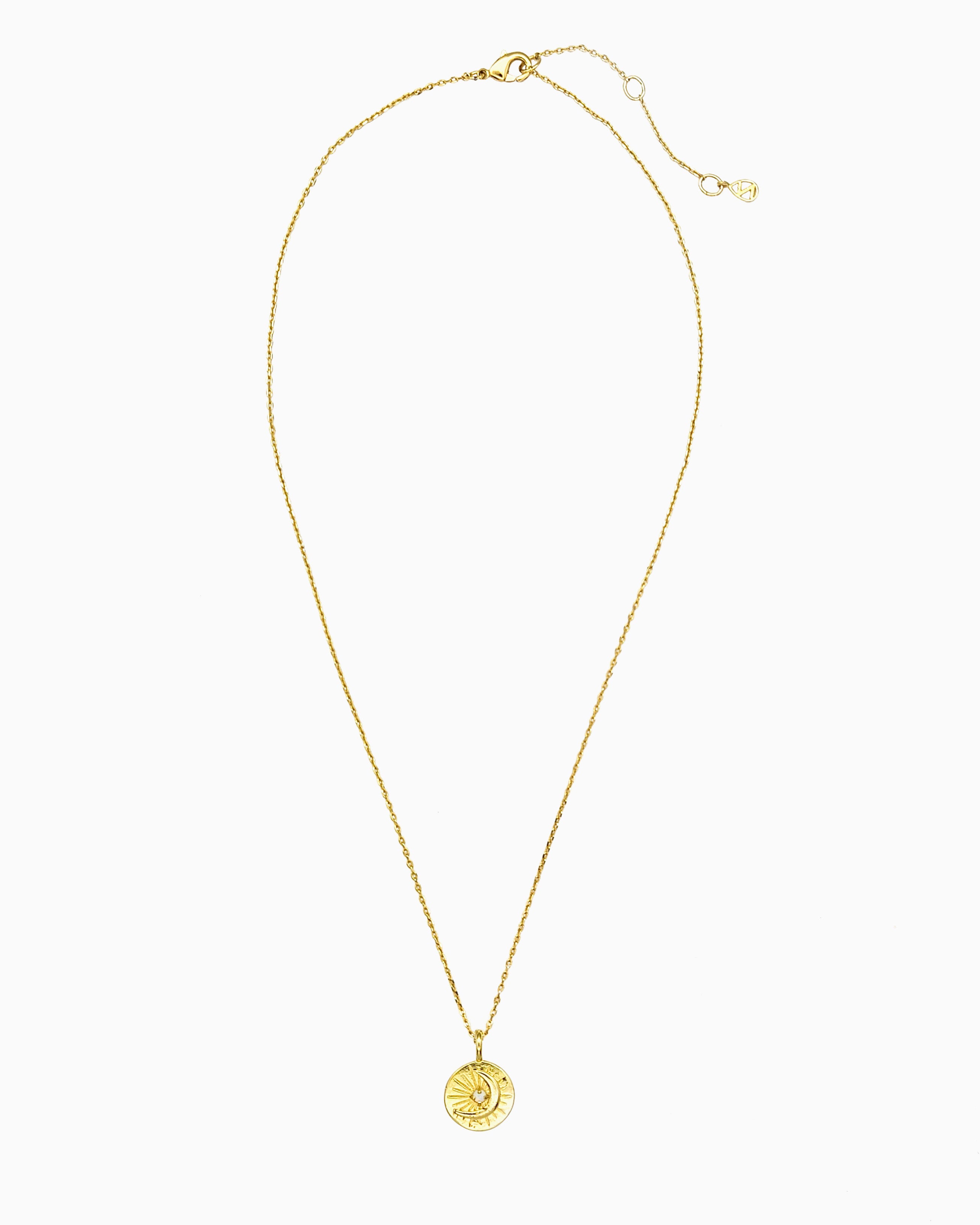 Celestial coin necklace with starburst and moon motif in gold finish