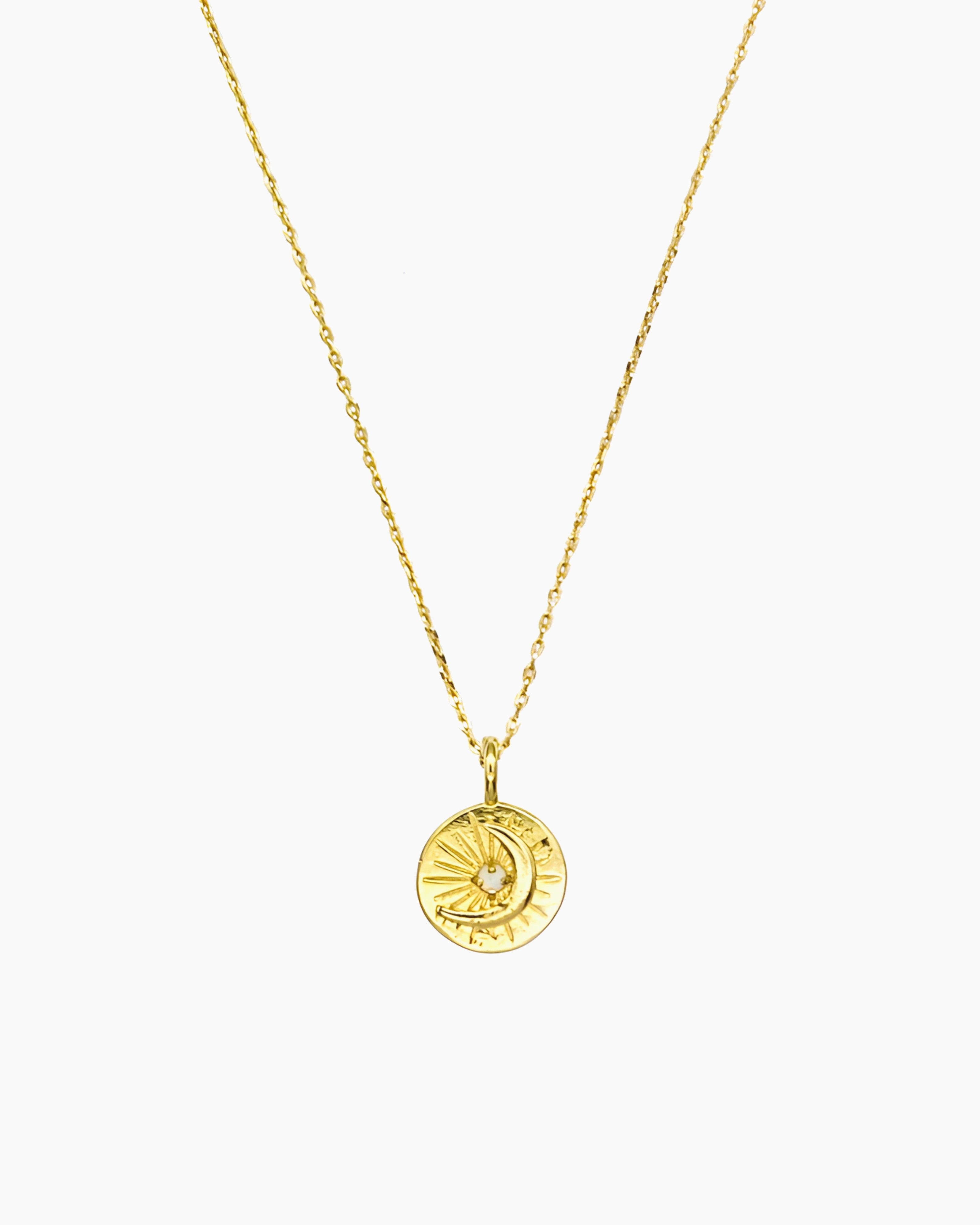Celestial coin necklace with starburst and moon motif in gold finish