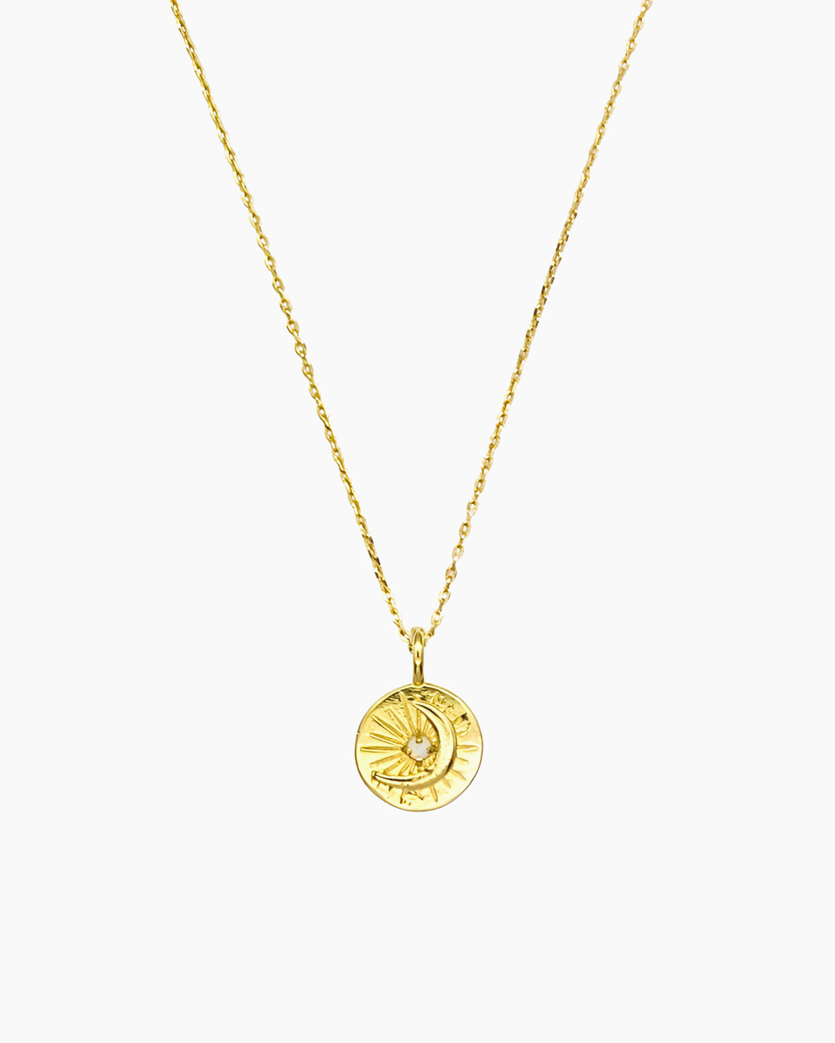 Celestial coin necklace with starburst and moon motif in gold finish