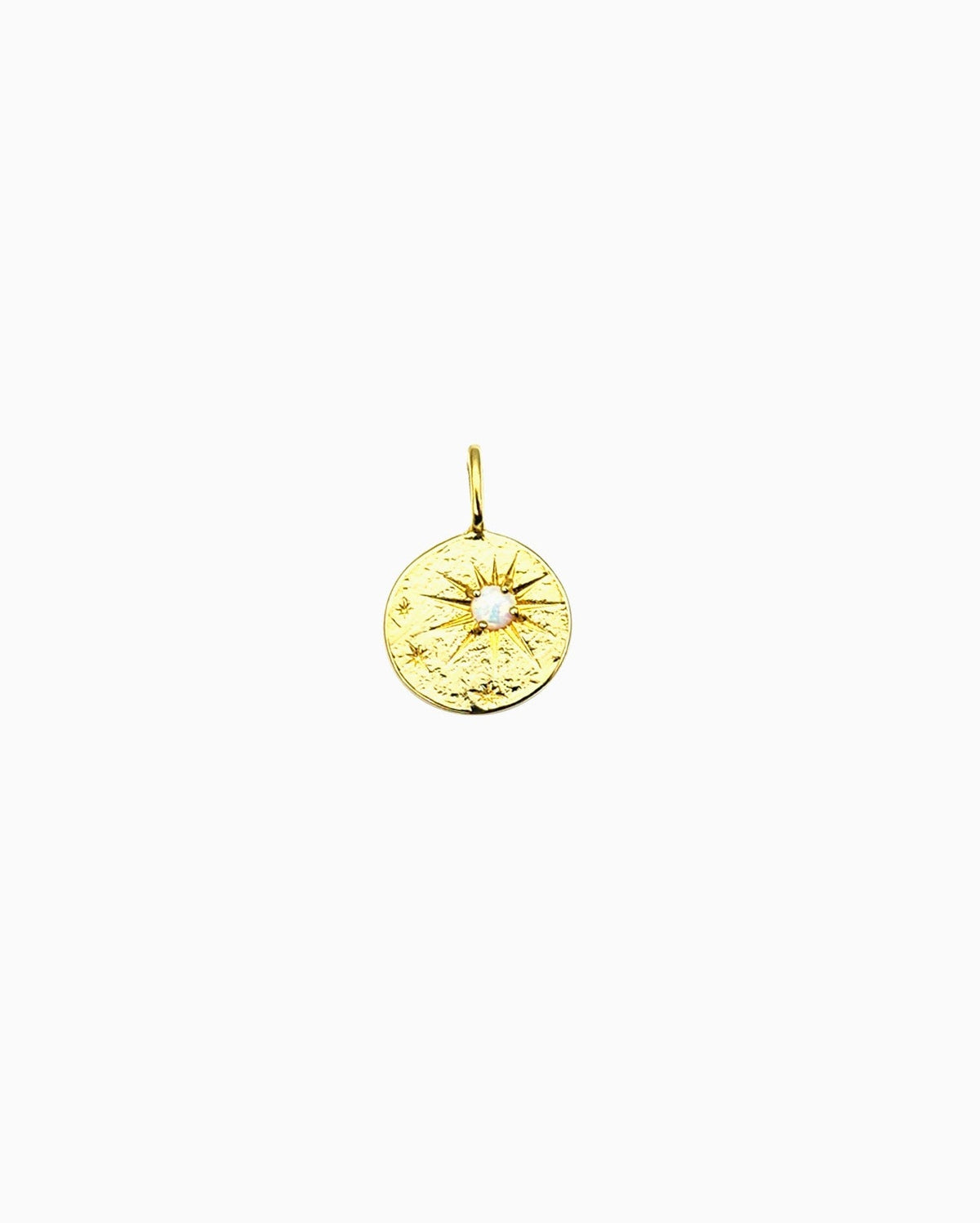 Gold clip-on coin charm with starburst engraving and a small opal center