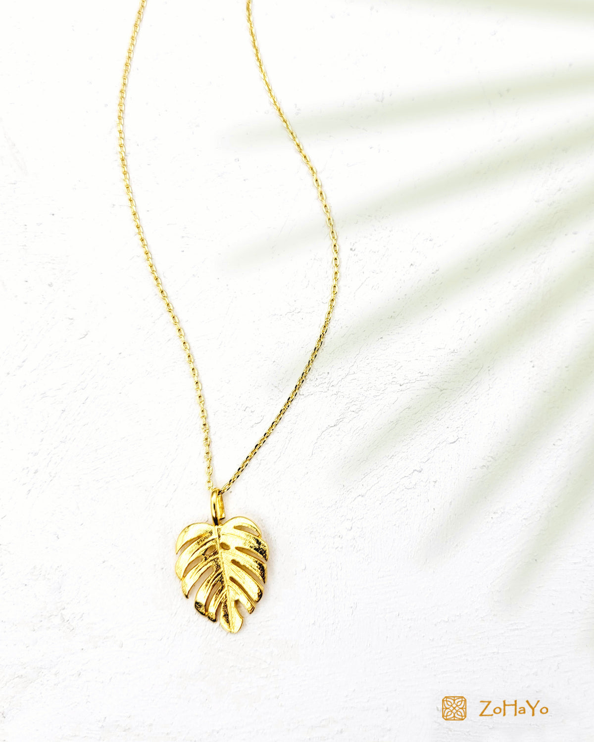 gold pvd plated monstera leaf pendant necklace