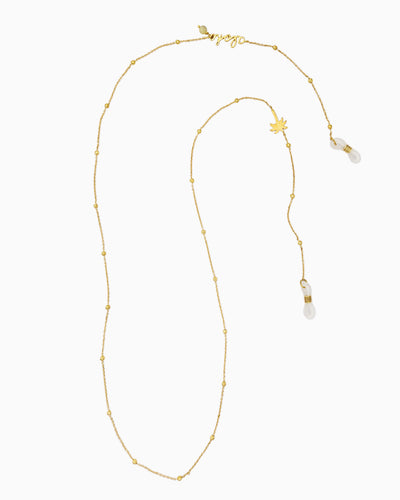 Sunlit Green sunglass chain with Aloha script, yellow turquoise bead, and brushed gold palm tree charm