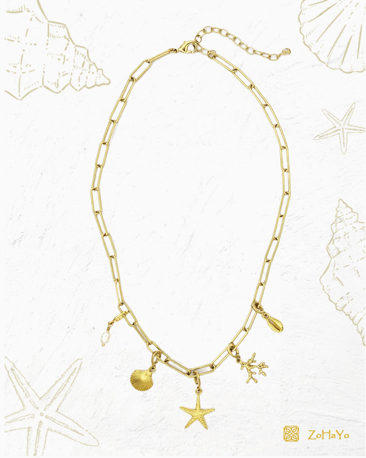 Seaside Charm Necklace with removable cowrie shell, coral branch, starfish, seashell, and  freshwater pearl clip-on charms on a gold paperclip chain