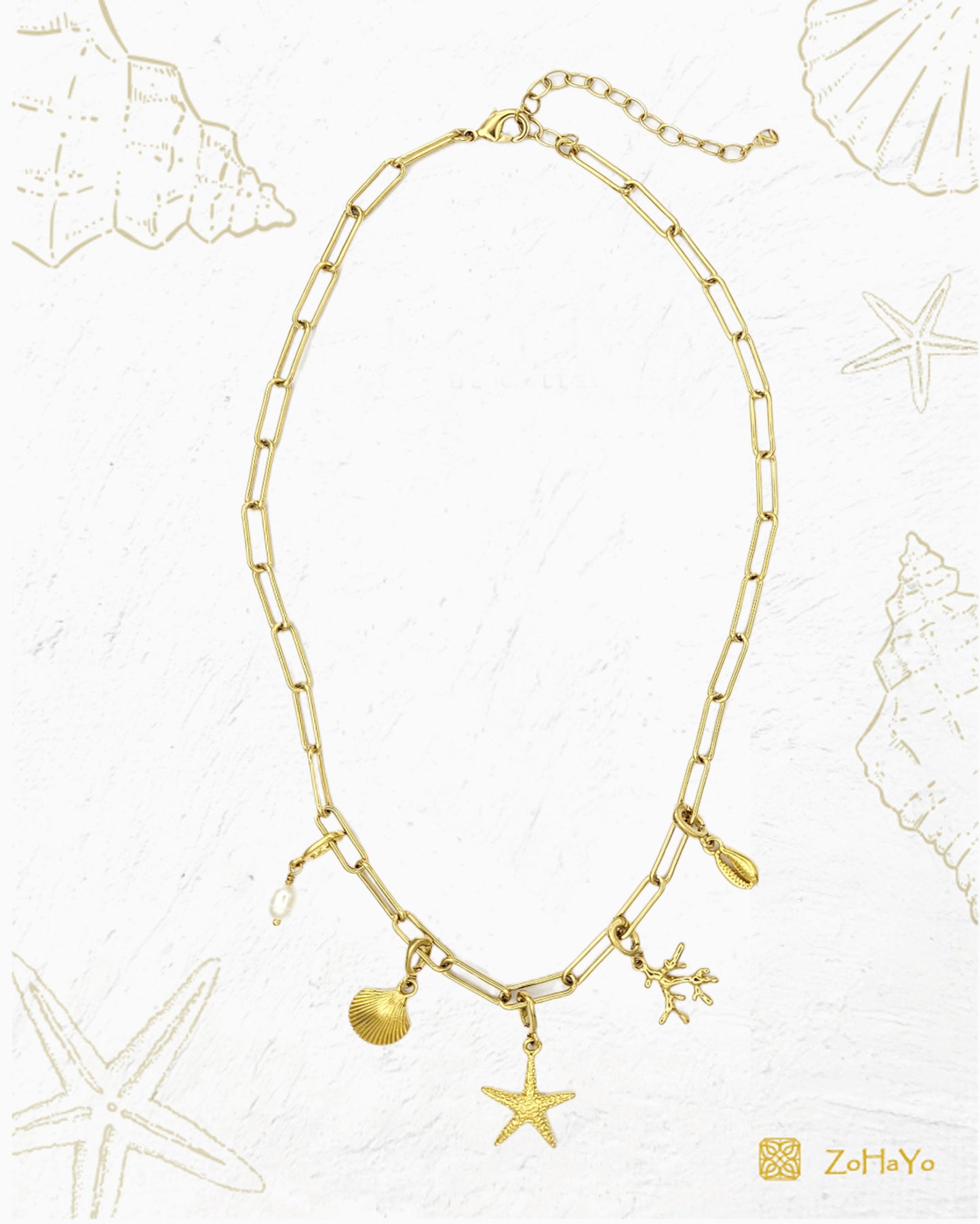 Seaside Charm Necklace with removable cowrie shell, coral branch, starfish, seashell, and  freshwater pearl clip-on charms on a gold paperclip chain