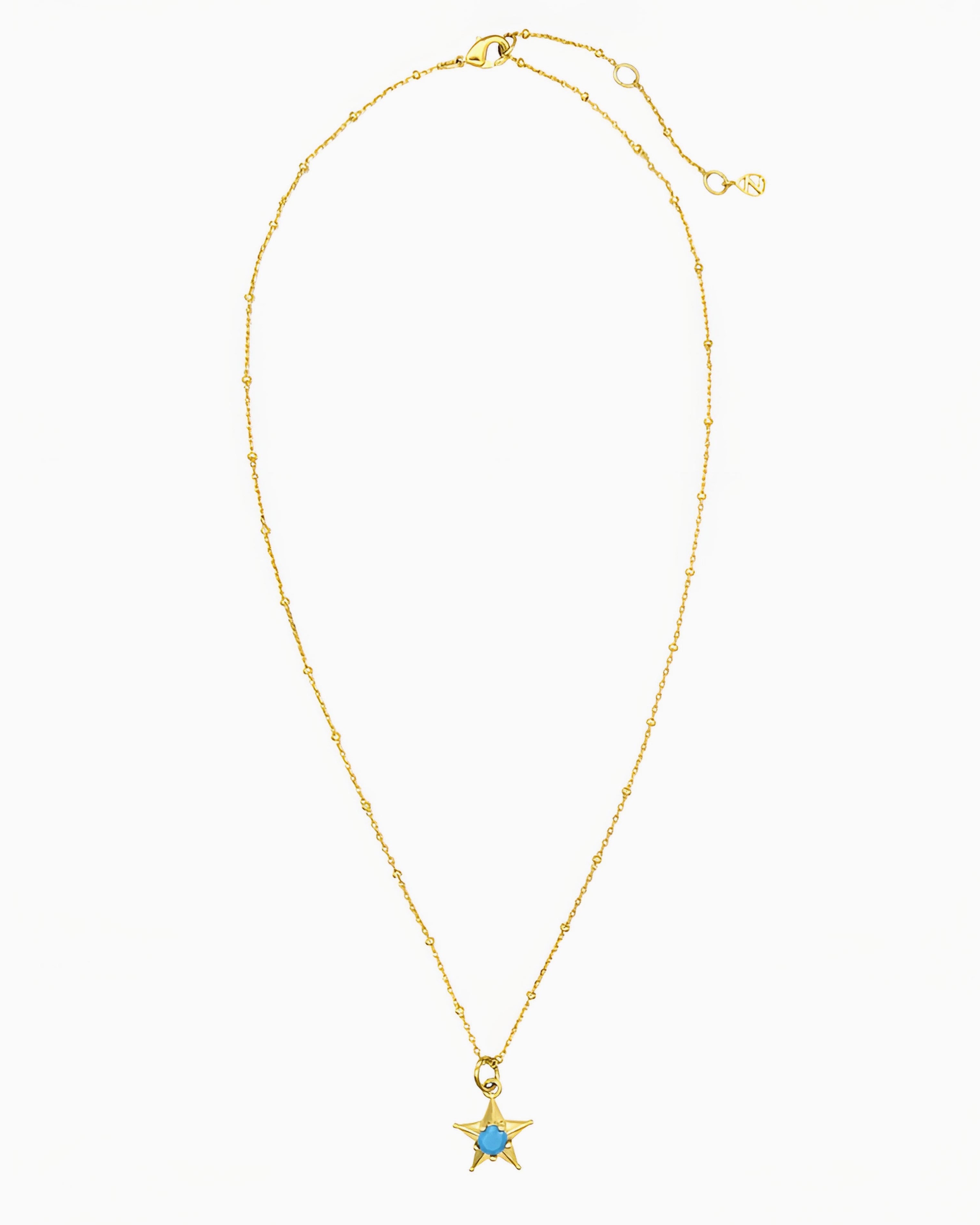 gold pvd plated star charm necklace with turquoise cz