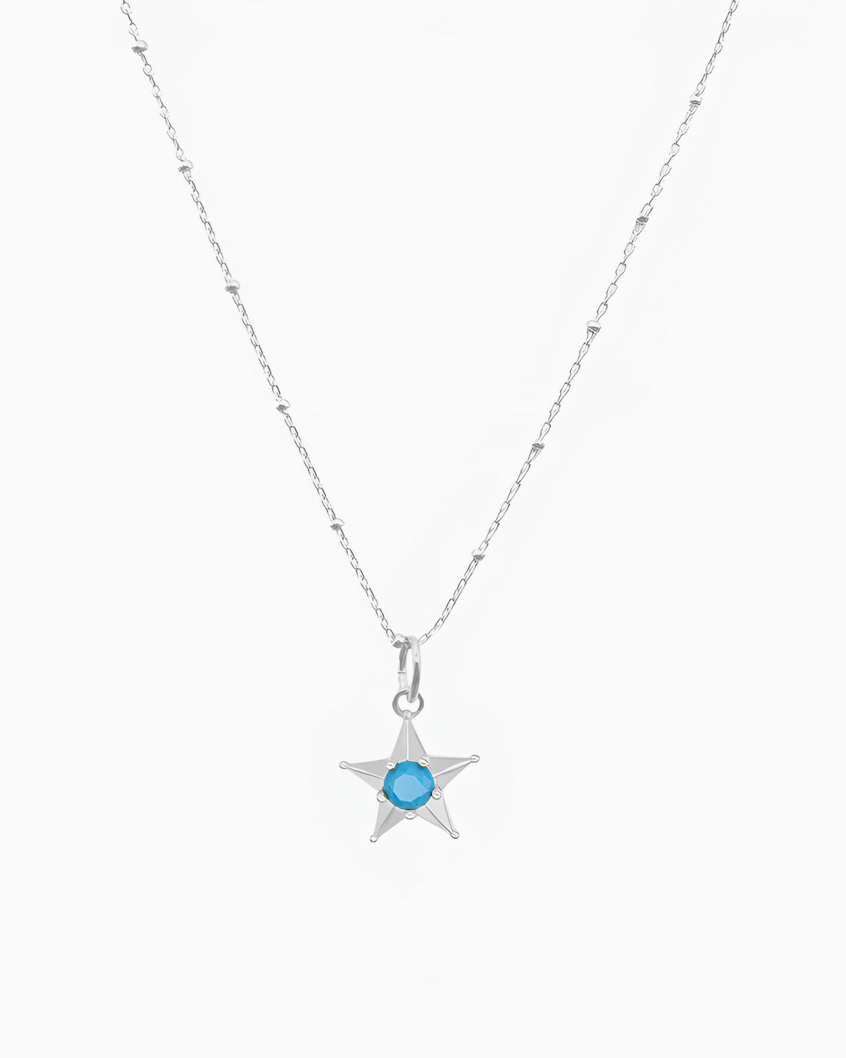 silver pvd plated star charm necklace with turquoise cz