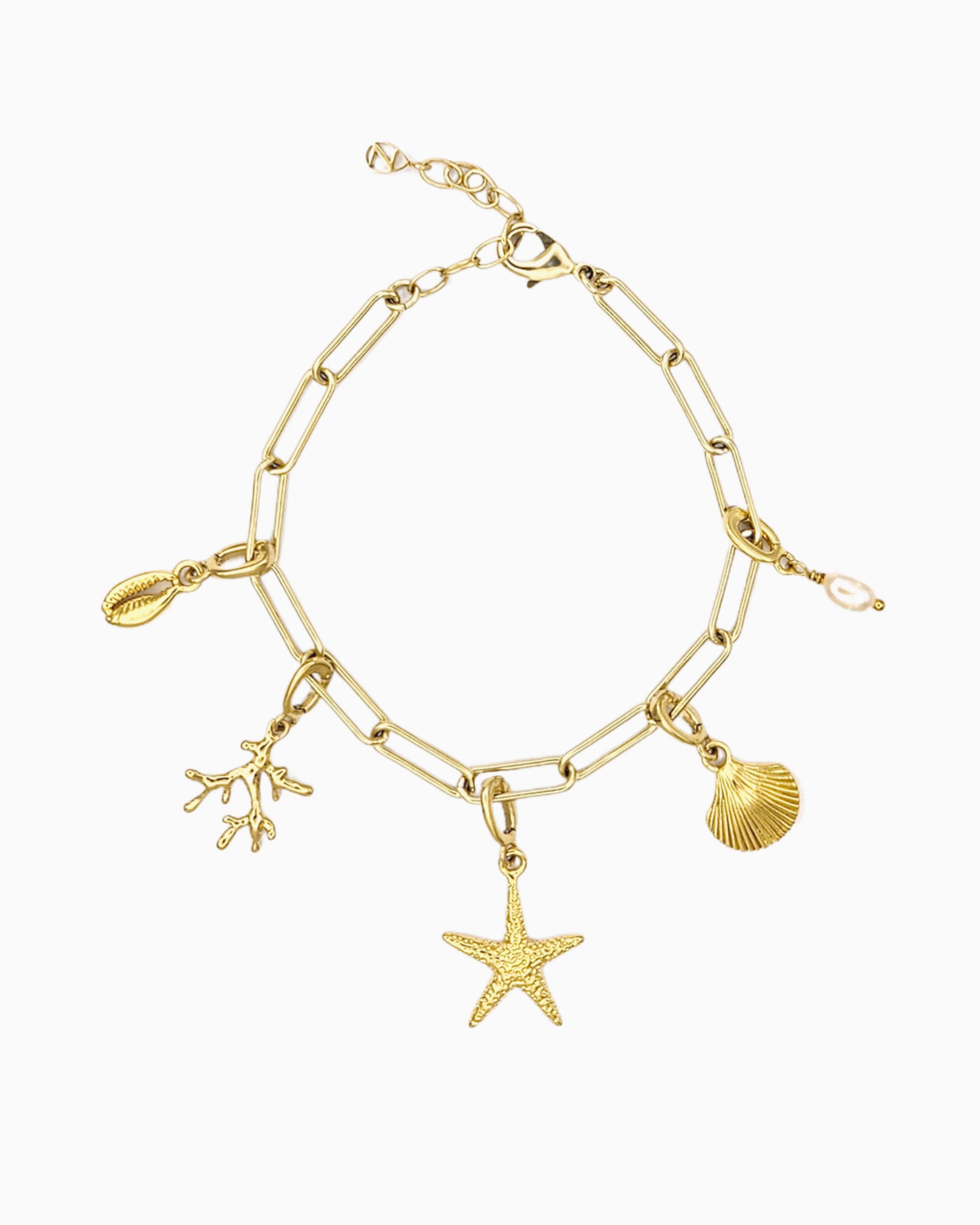Seaside Charm Bracelet with removable cowrie shell, coral branch, starfish, seashell, and  freshwater pearl clip-on charms on a gold paperclip chain
