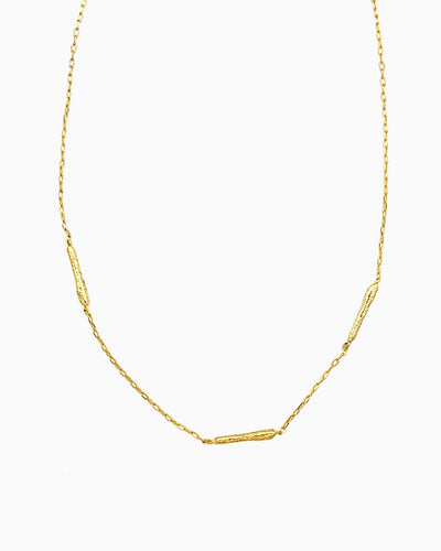oft erosion bar necklace with front toggle clasp in gold finish