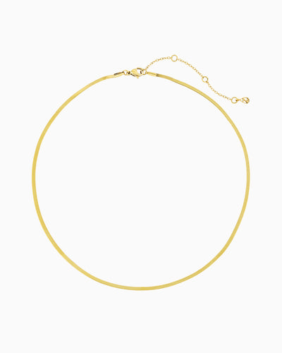 Gold herringbone chain necklace with a sleek flat chain design.