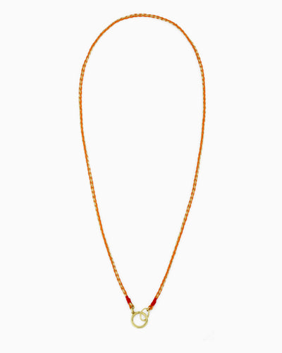 Hand-braided green cord necklace with a gold charm holder ring, designed to be worn alone or personalized with ZoHaYo Clip-On Charms.
