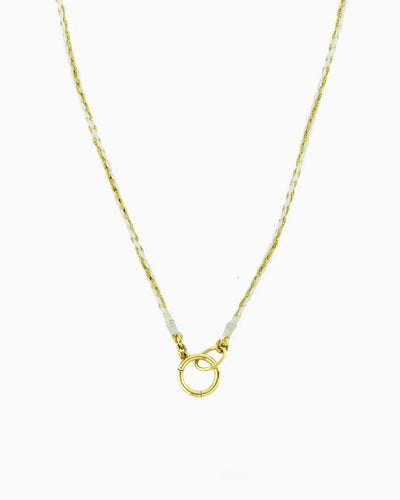 Hand-braided green cord necklace with a gold charm holder ring, designed to be worn alone or personalized with ZoHaYo Clip-On Charms.