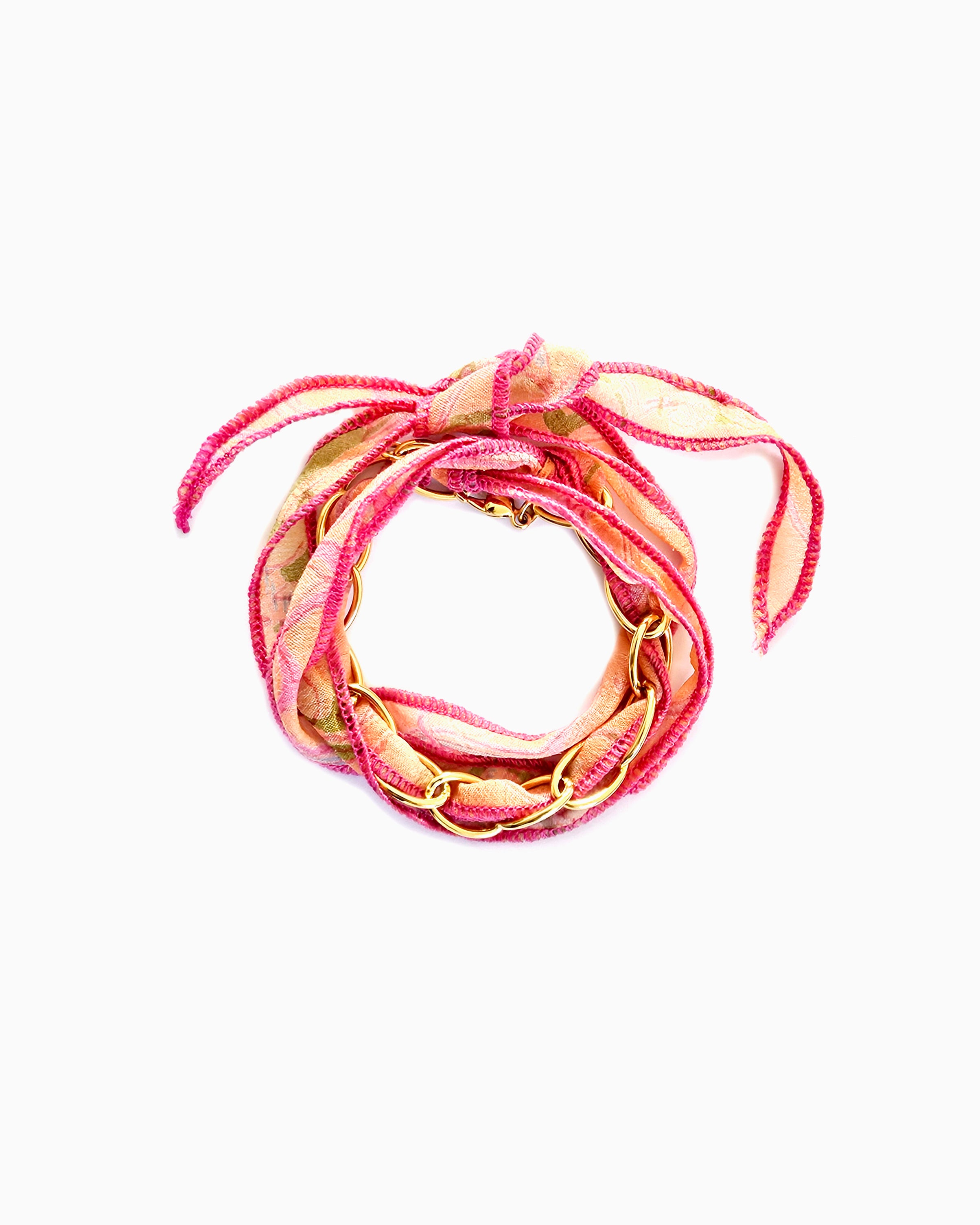 Pink Zest silk ribbon chain bracelet with pink, apricot & green patterned ribbon and hot pink stitching