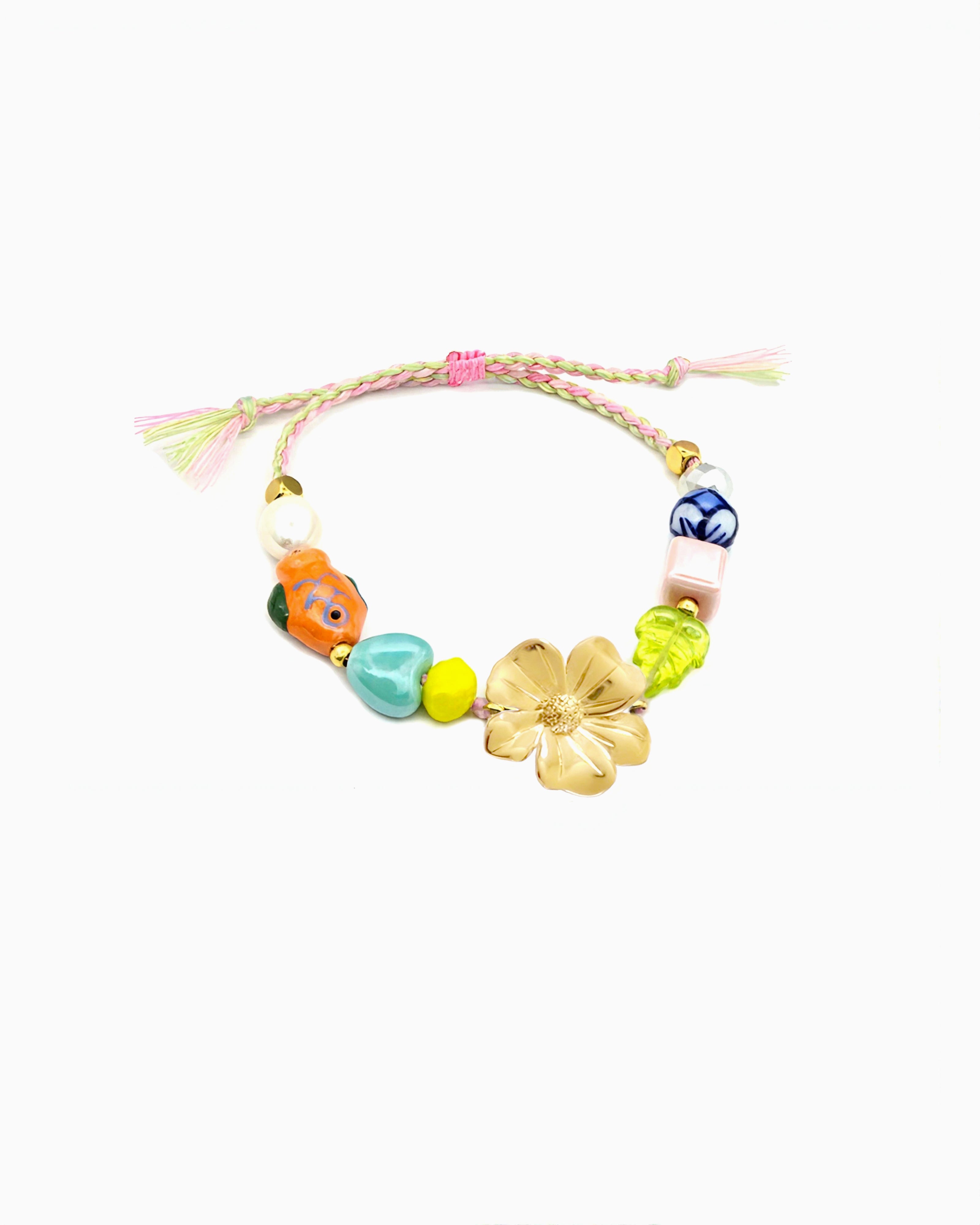 Adjustable braided bracelet with colorful beads and flower centerpiece