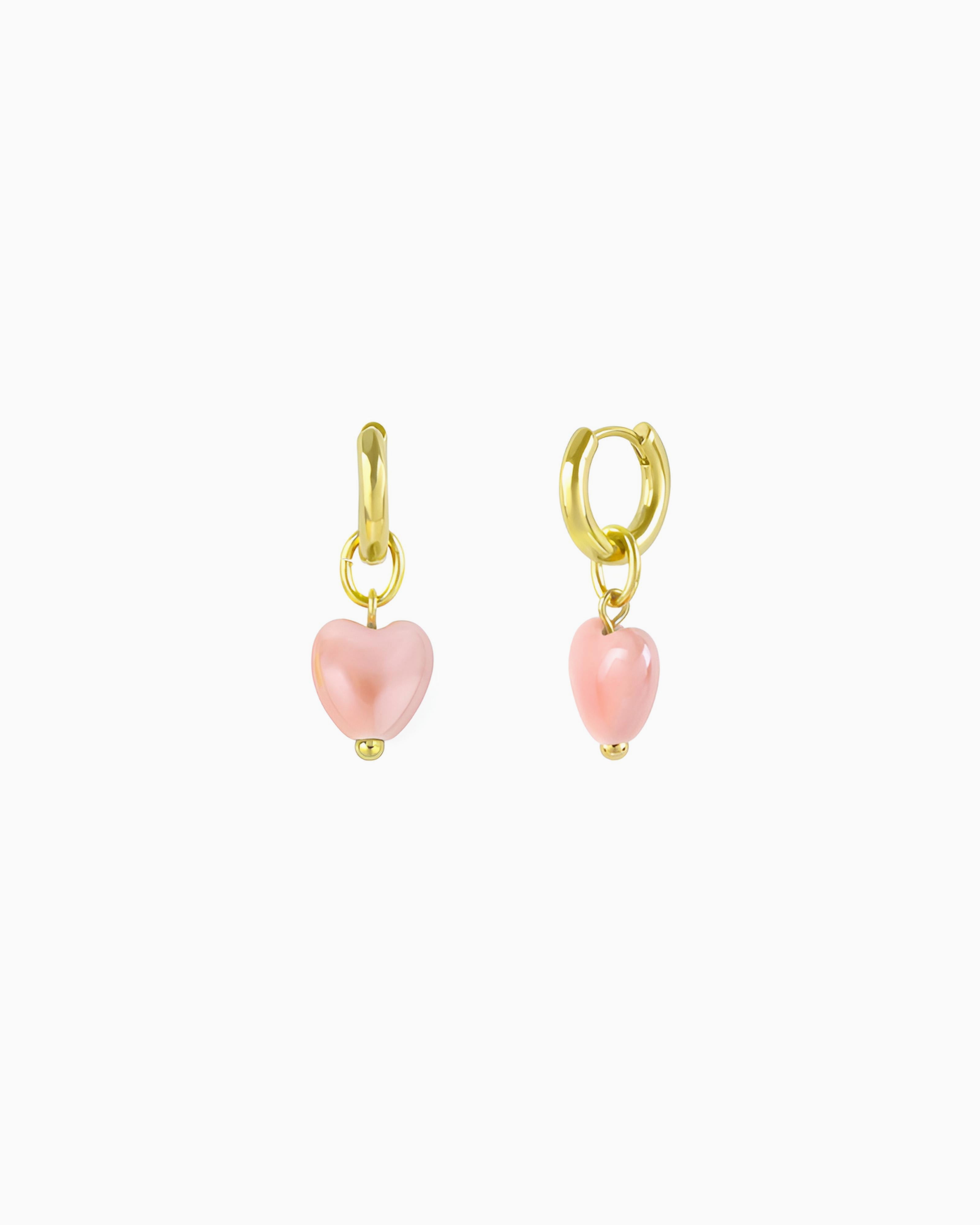 Gold huggie earrings with interchangeable pink ceramic heart charms