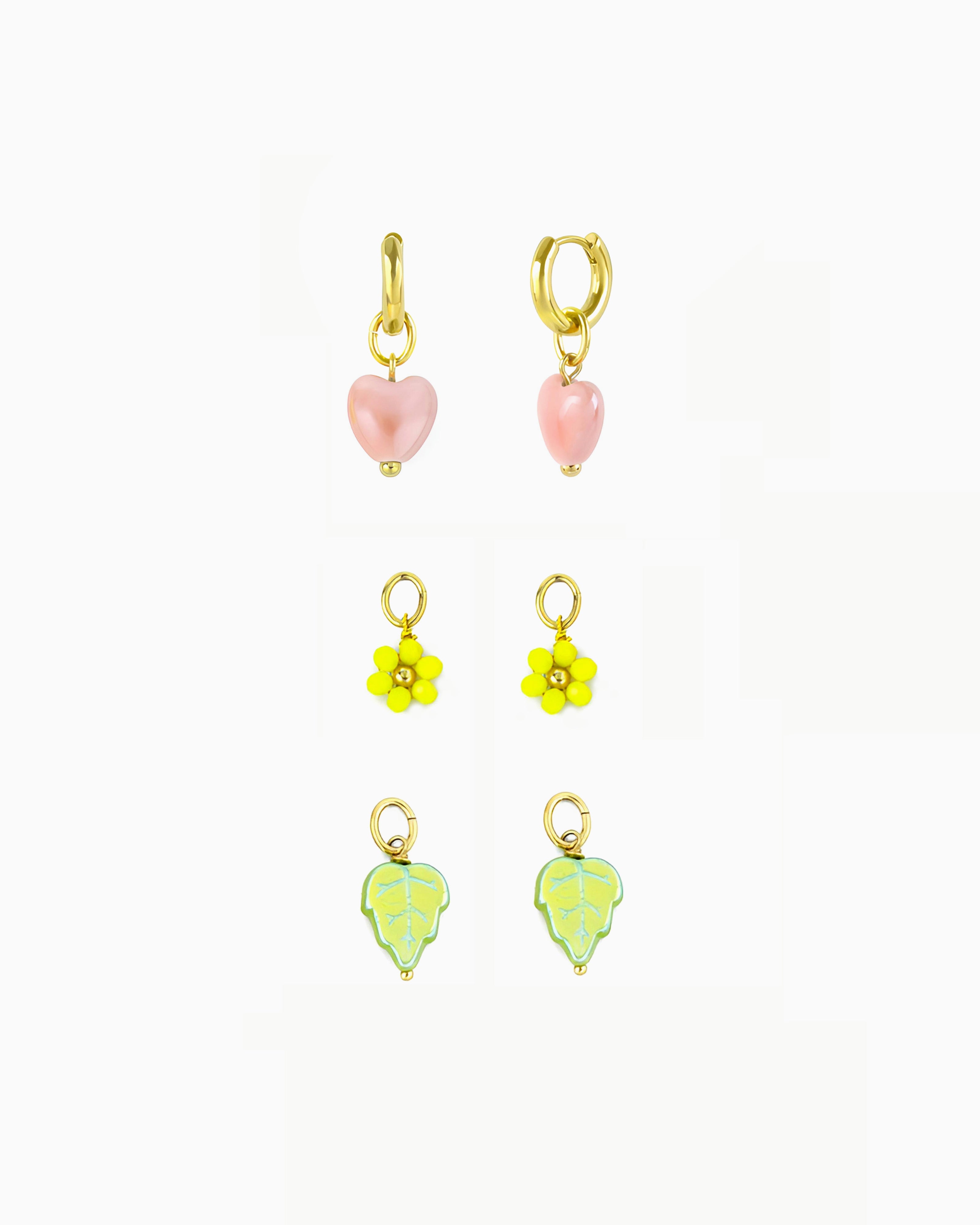 Gold huggie earrings with interchangeable heart, flower and leaf charms