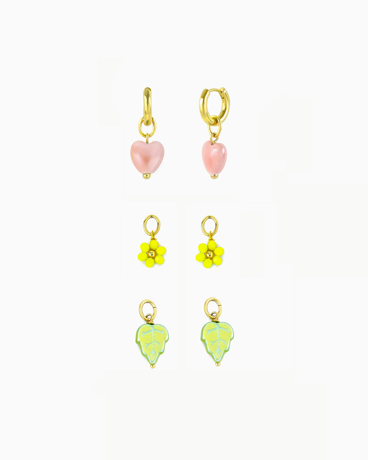 Gold huggie earrings with interchangeable heart, flower and leaf charms