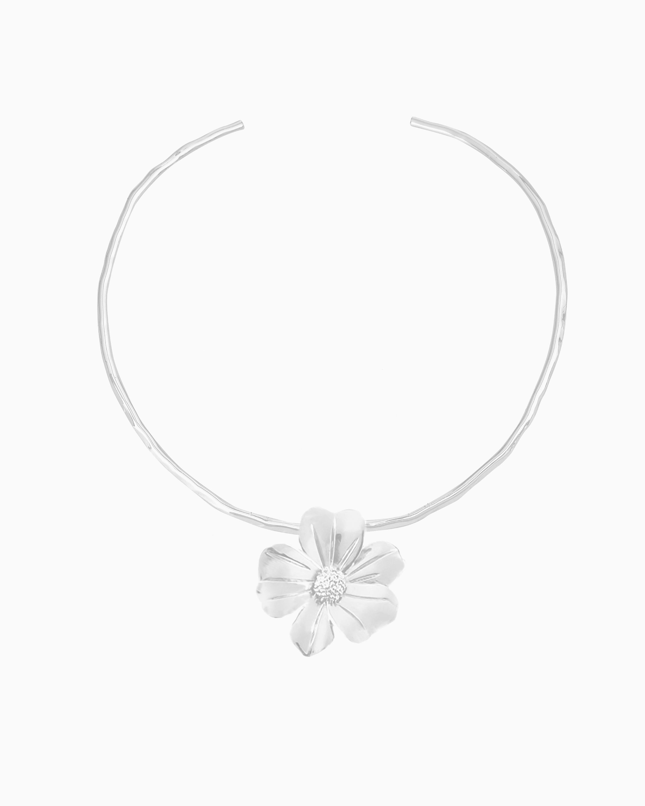 silver hand-hammered collar necklace with bold flower pendant