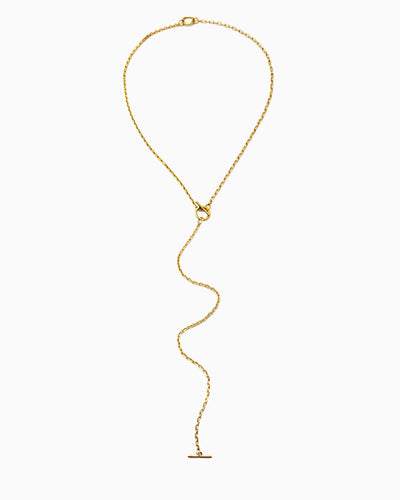 Dual toggle gold chain necklace styled as a lariat and layered two-row necklace