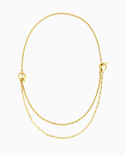 Dual toggle gold chain necklace styled as a lariat and layered two-row necklace
