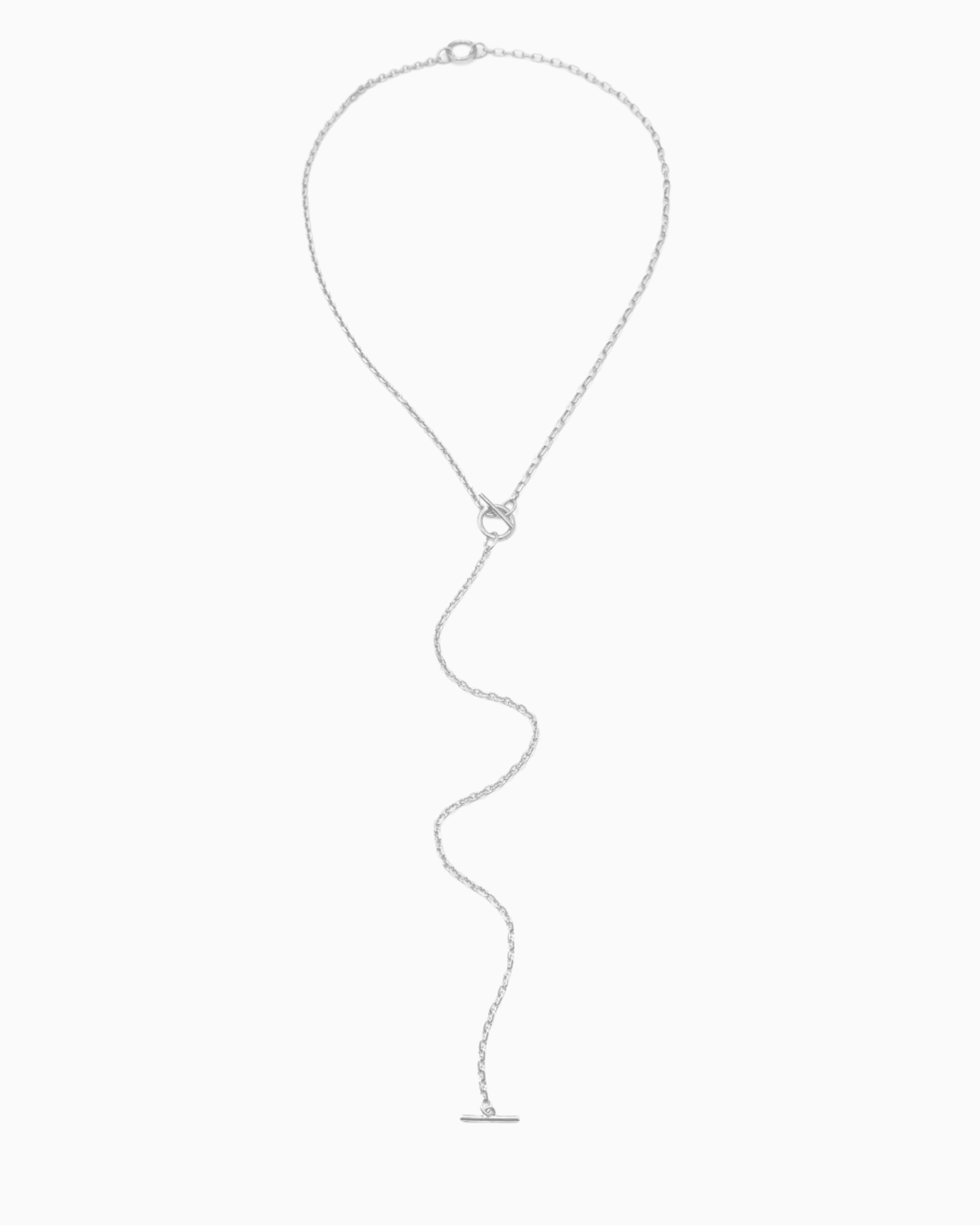 Dual toggle silver chain necklace styled as a lariat and layered two-row necklace