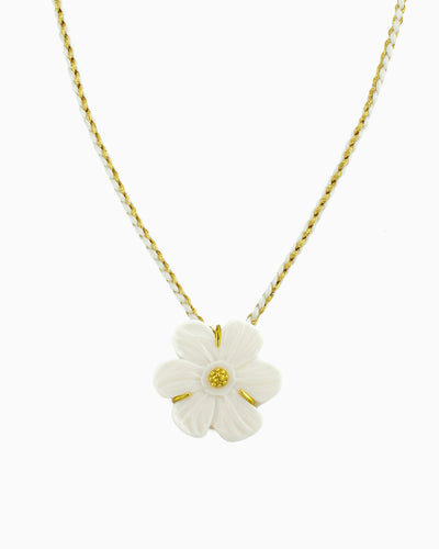 cream white flower pendant on braided cord necklace in soft neutral tones