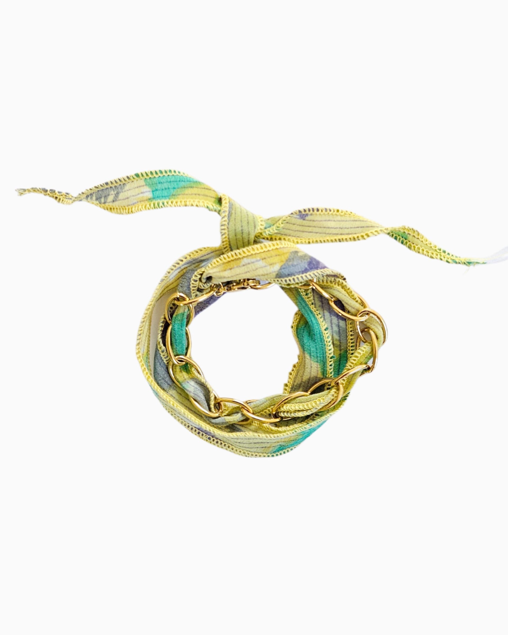 Gold chain bracelet with silk ribbon woven through links