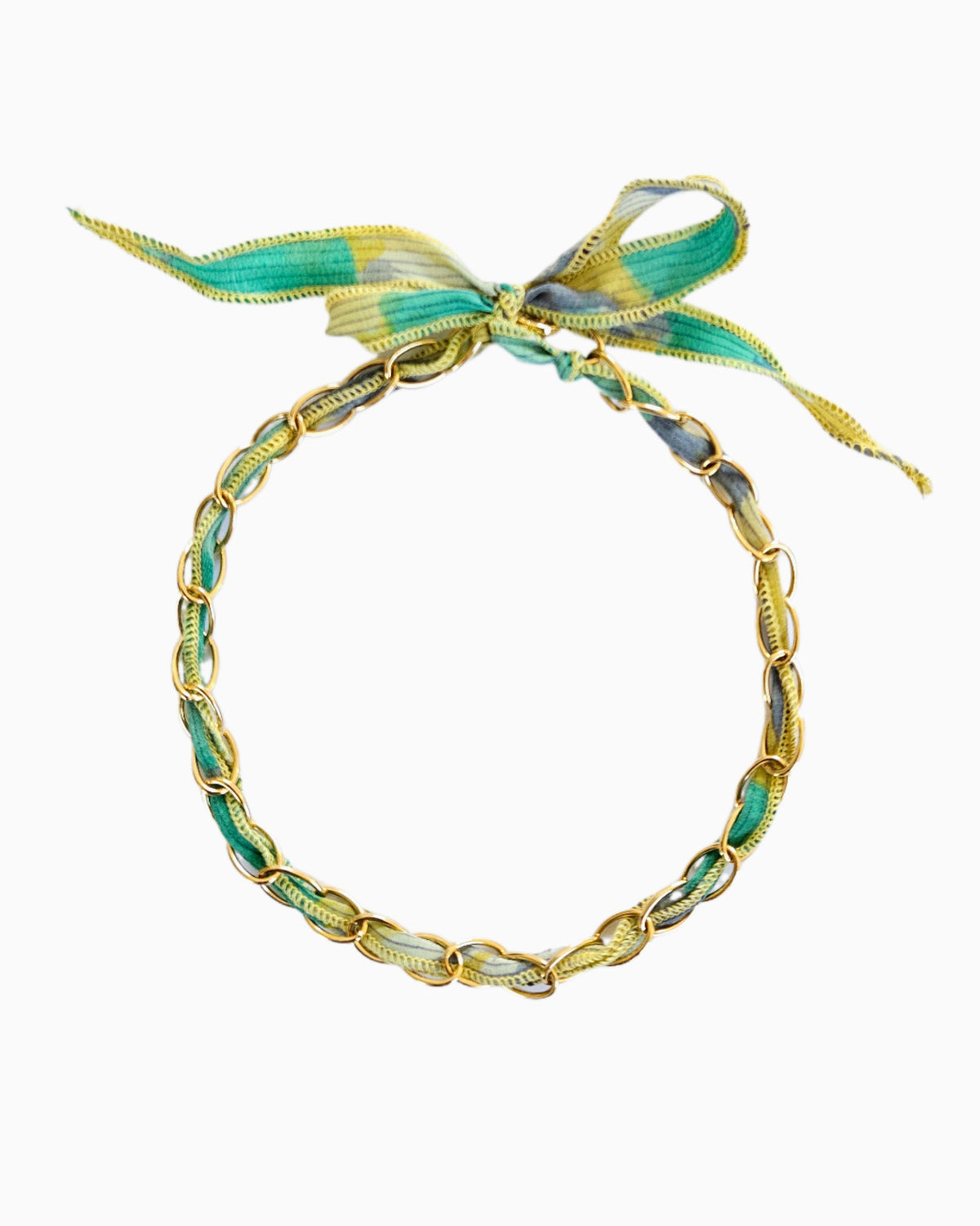 Gold chain necklace with silk ribbon woven through links