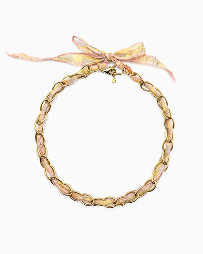Gold chain necklace with silk ribbon woven through links