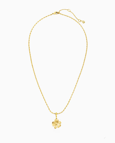 gold flower charm necklace with clip-on charm on delicate chain