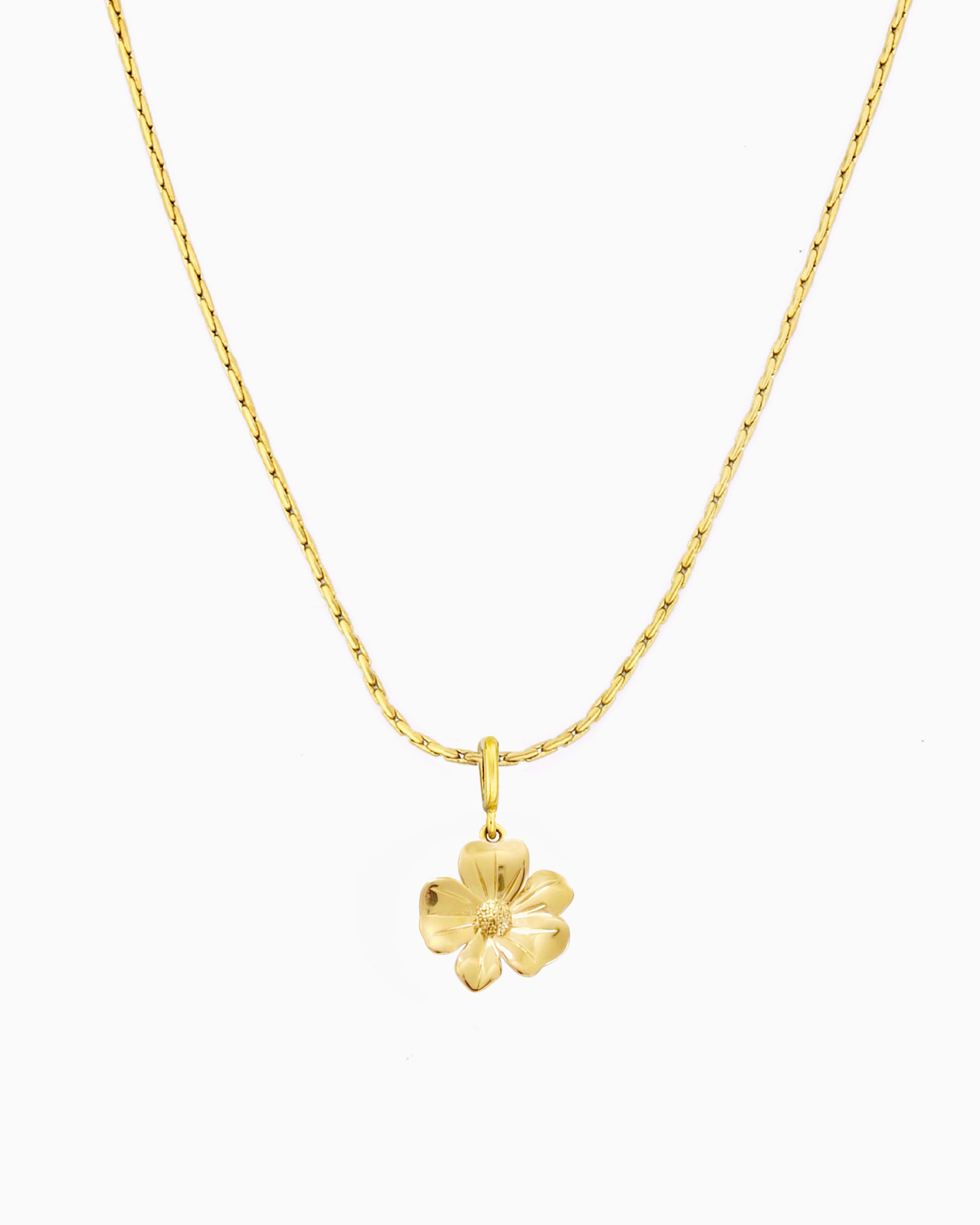 gold flower charm necklace with clip-on charm on delicate chain