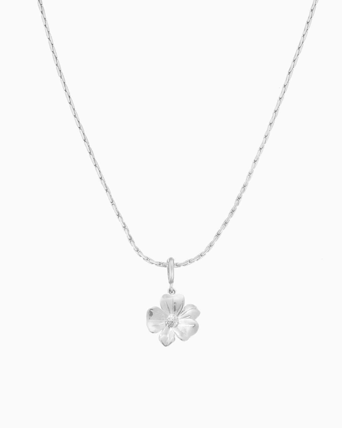 silver flower charm necklace with clip-on charm on delicate chain