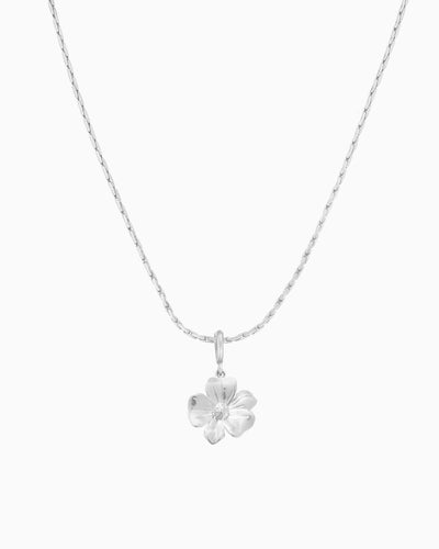 silver flower charm necklace with clip-on charm on delicate chain