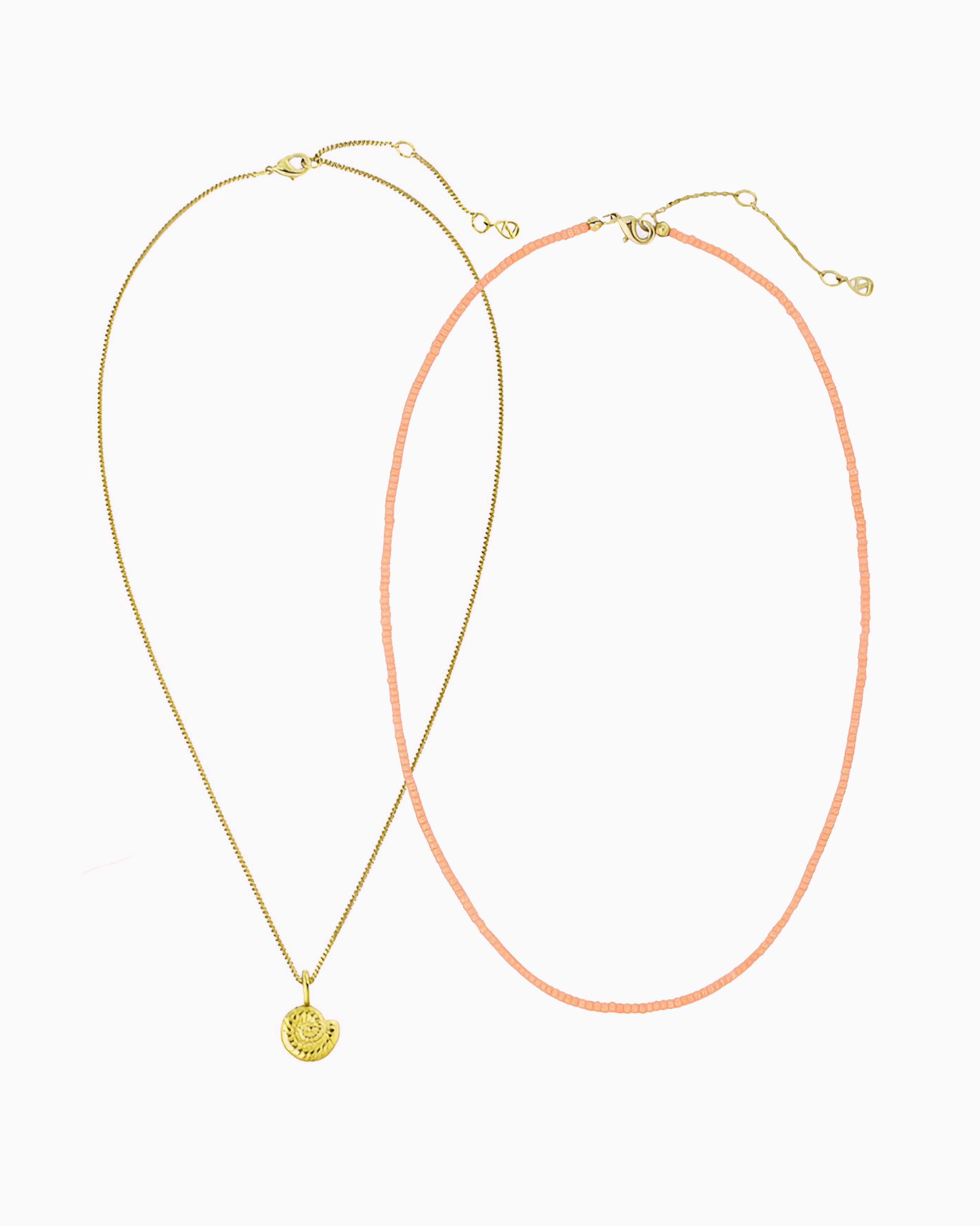 Peach Coral Nautilus Necklace featuring a delicate curb chain strand, peach coral Miyuki seed bead strand, and removable nautilus clip-on charm in gold