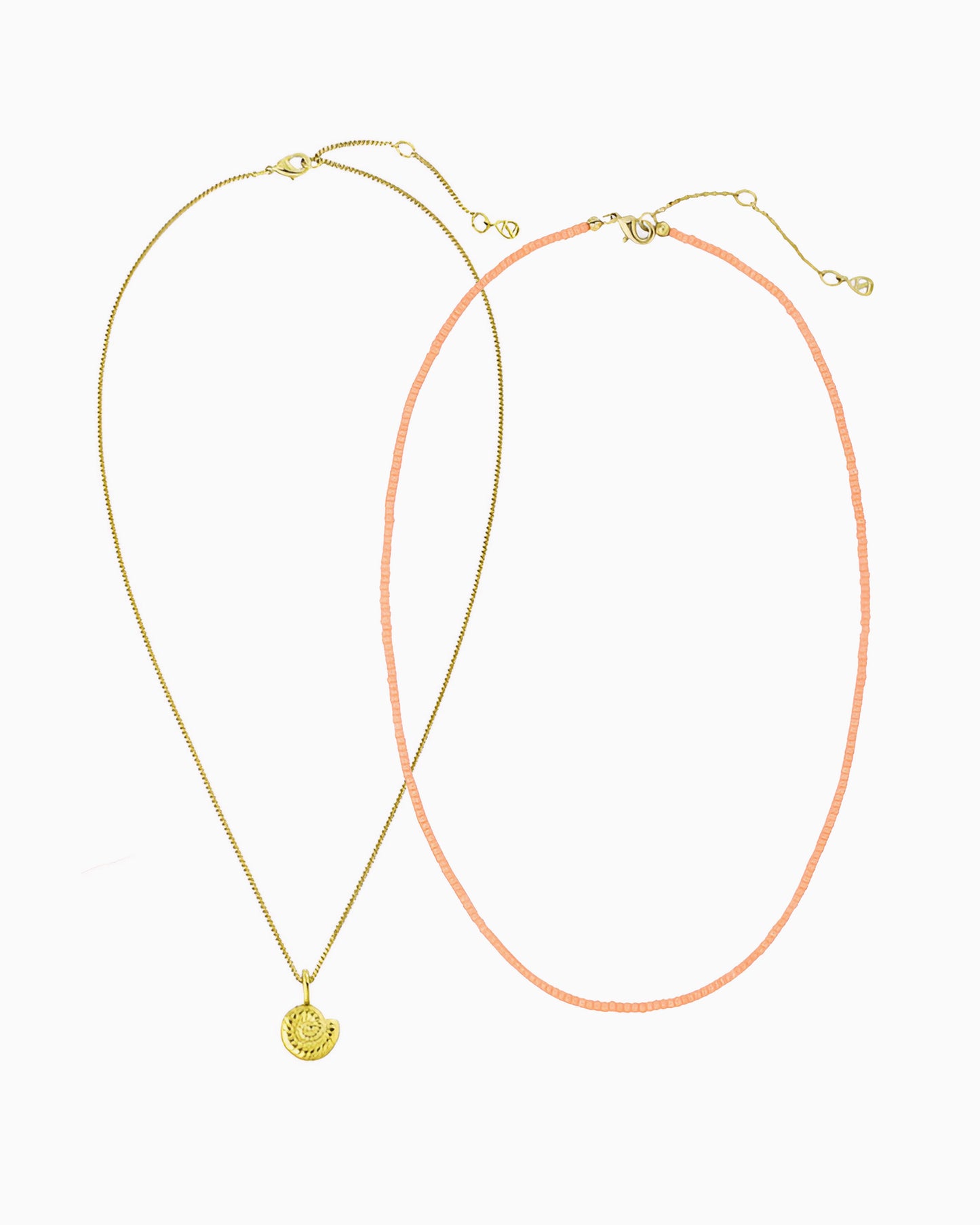 Peach Coral Nautilus Necklace featuring a delicate curb chain strand, peach coral Miyuki seed bead strand, and removable nautilus clip-on charm in gold