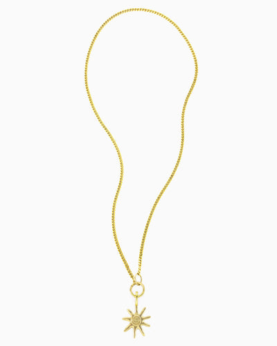 Gold curb chain necklace featuring a hinged charm holder and removable Sunray Clip-On Charm.