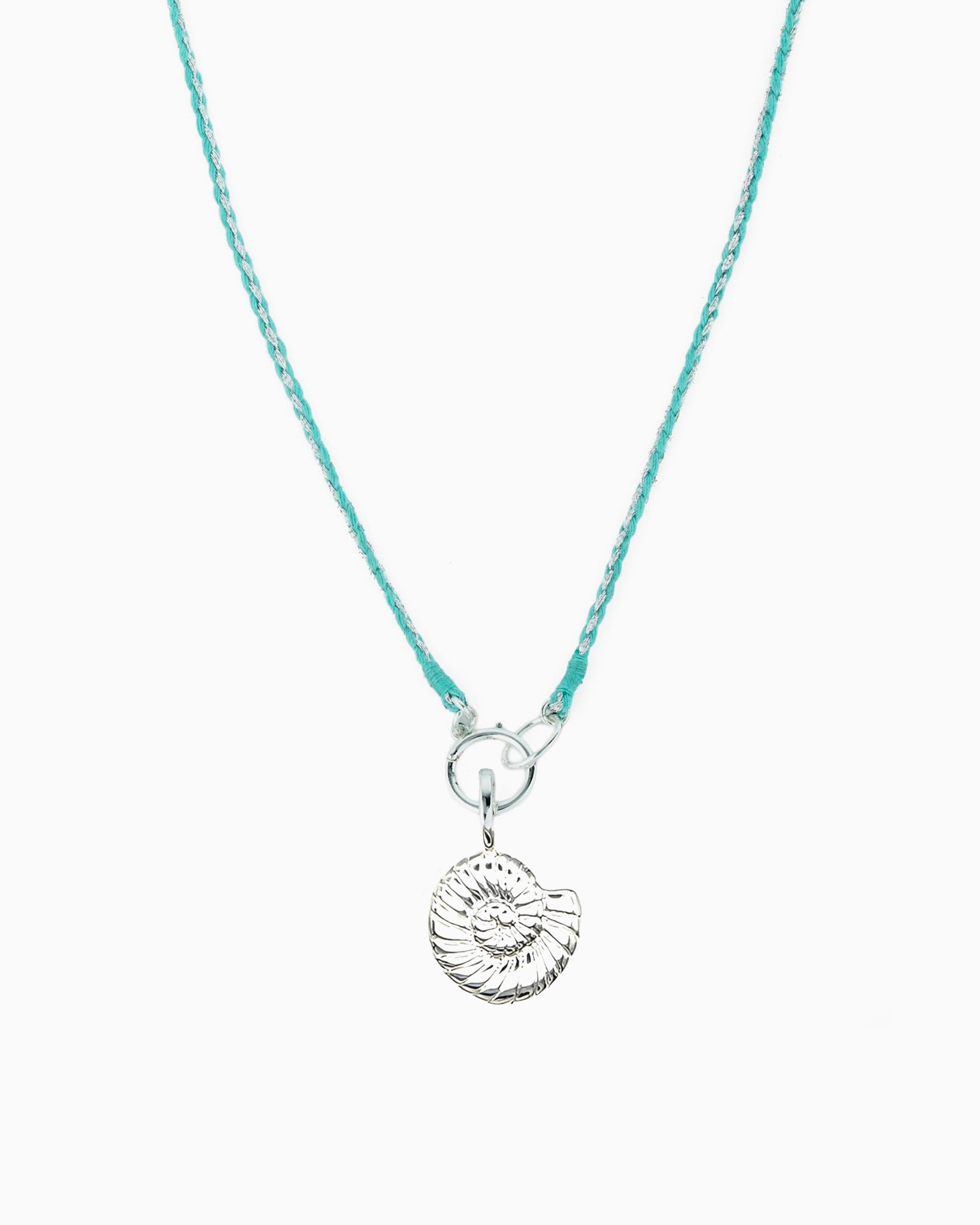 Turquoise and metallic silver braided cord necklace with a hinged charm holder and removable silver nautilus clip-on charm.