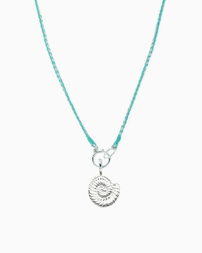 Turquoise and metallic silver braided cord necklace with a hinged charm holder and removable silver nautilus clip-on charm.