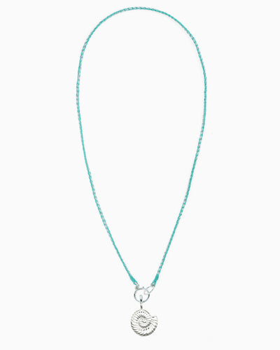 Turquoise and metallic silver braided cord necklace with a hinged charm holder and removable silver nautilus clip-on charm.