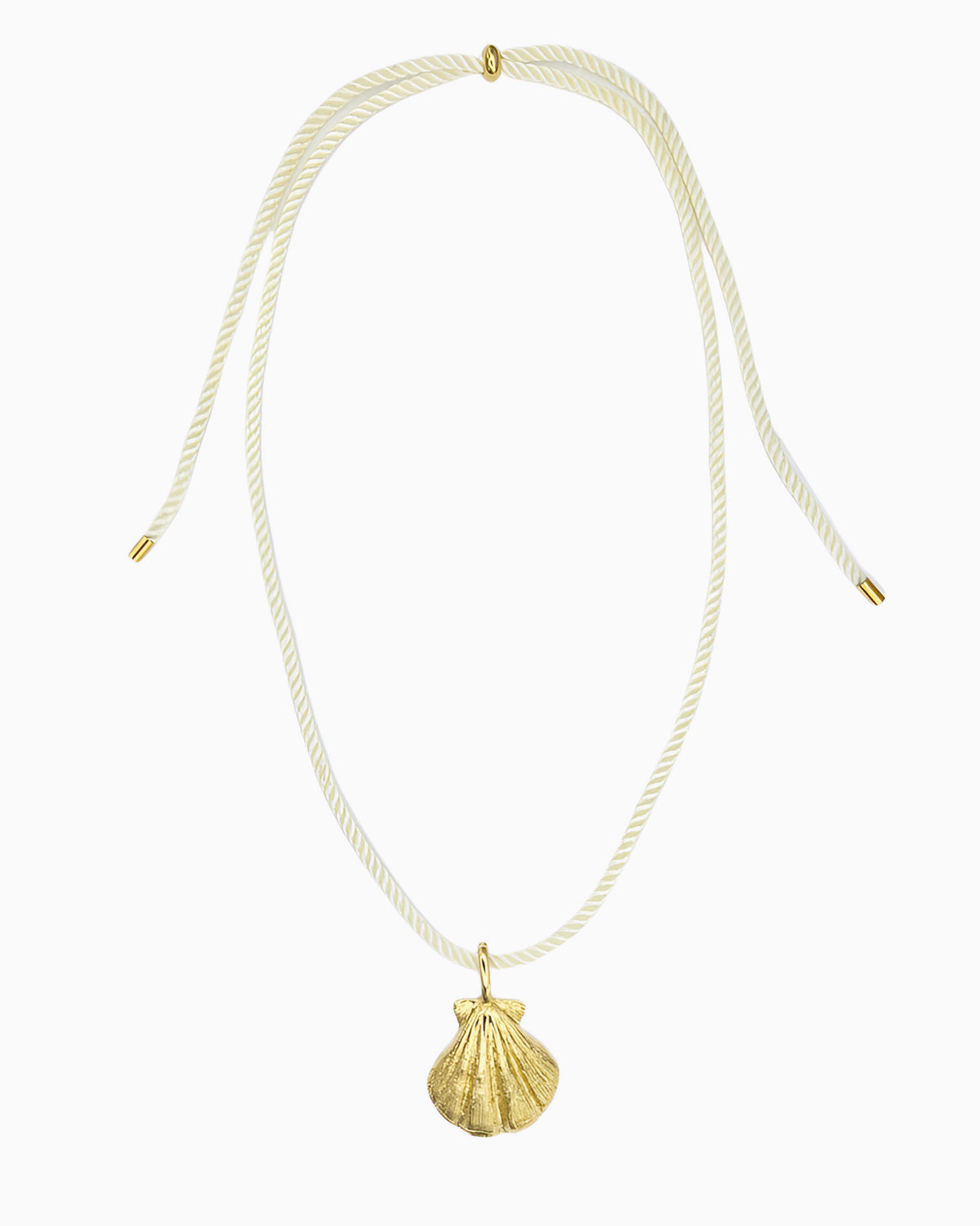 Ivory cord necklace featuring a detailed seashell clip-on charm inspired by a shell found along the shore.