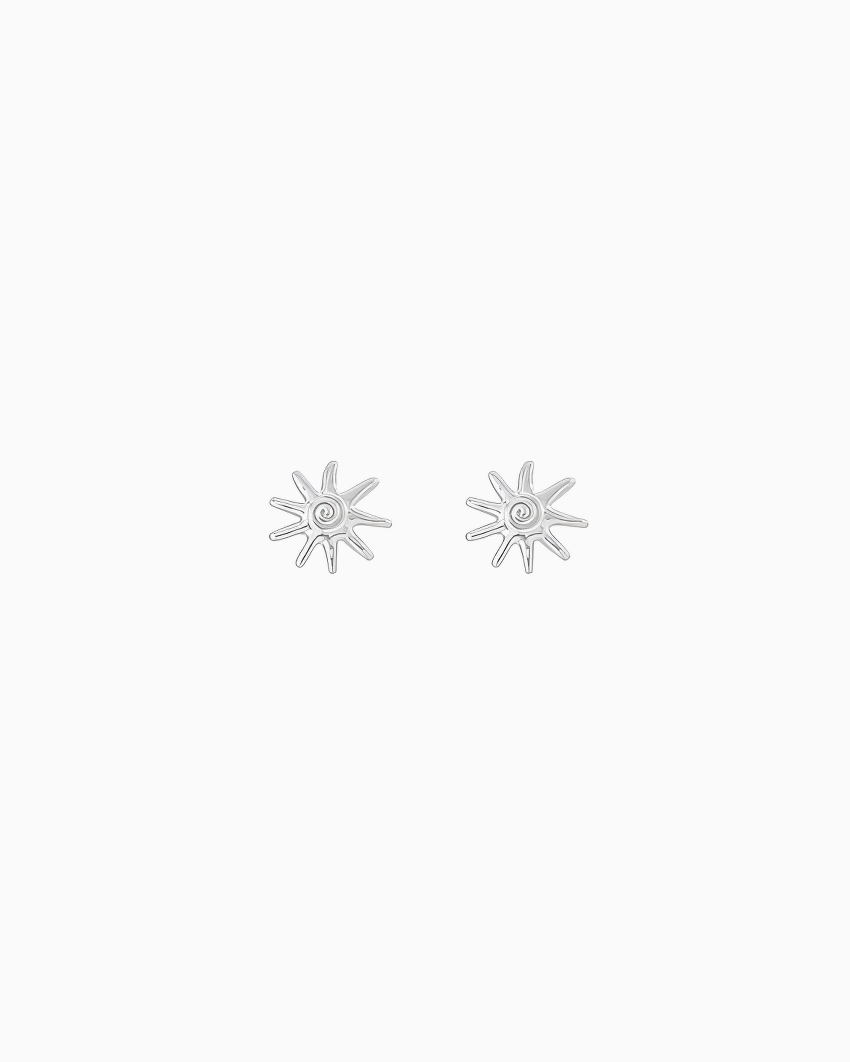 Silver sunray stud earrings with a polished finish