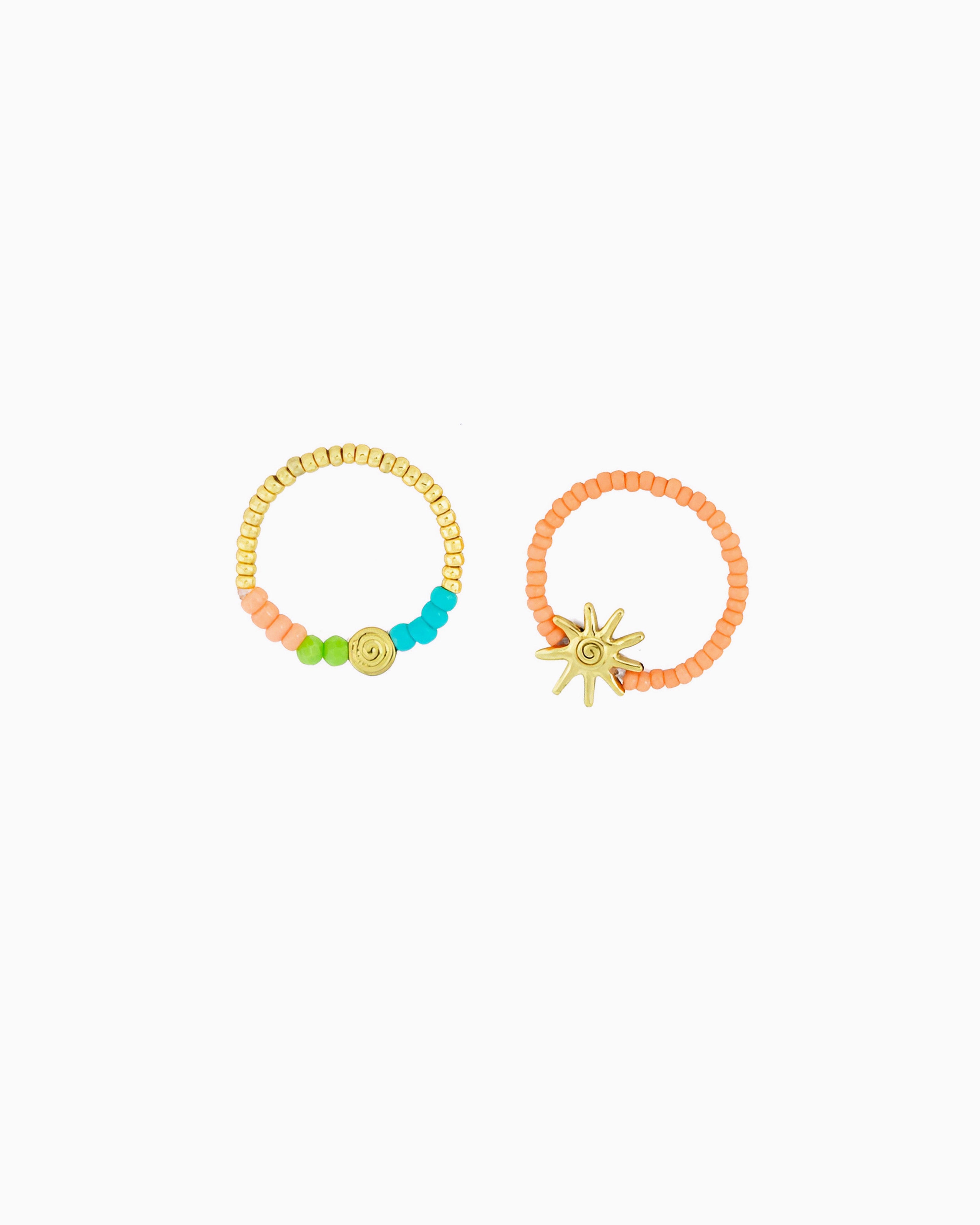 A playful ring featuring colorful beads, gold-tone accents, and sunray-inspired details. Inspired by sunny days by the sea, it adds a cheerful coastal touch to any jewelry stack.