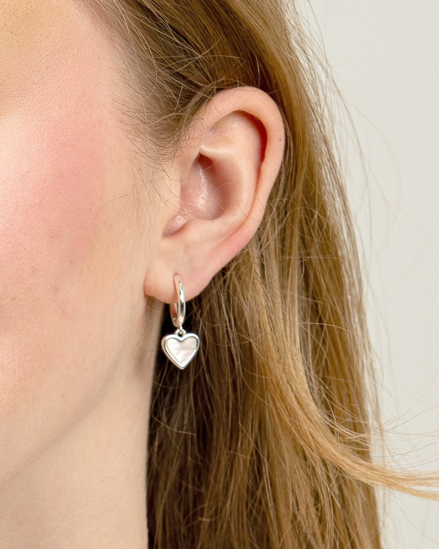 MOP HEART DROP HUGGIE EARRINGS